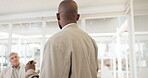 Presentation, whiteboard and meeting with a business black man talking to his team in the boardroom during a seminar. Training, coaching and workshop with a male employee teaching staff at work