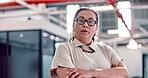 Portrait, mission and a determined business woman in the office standing with her arms crossed feeling serious. Vision, mindset and focus with a female employee looking confident while working