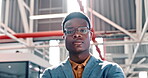Confident businessman, serious and arms crossed in management standing with serious or tough expression at the office. Portrait of black man employee manager in leadership with crossed arms at work