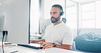 Businessman, call center and consulting in telemarketing, customer support or service at office. Employee man consultant talking and typing on computer in communication giving advice or help at desk