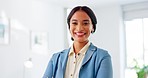 Success, face and business woman in the office with smile, confidence and positive mindset. Happiness, proud and portrait of a professional female employee from Brazil standing in a modern workplace.