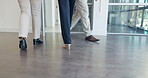 Teamwork, corporate or business people legs walking into office for meeting, company review or workshop in boardroom. Collaboration, heels or women feet travel, journey or commute together in lobby