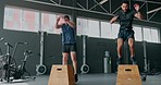 Fitness, gym and men with jump box for exercise, workout and training together. Strong athlete people train for health and wellness goals, achievement and sports performance on wood for cardio