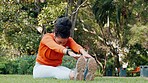 Stretching, calm and breathing woman on grass in park or nature environment for fitness workout session. Wellness and health lifestyle of sports person doing muscle relax exercise sitting on ground