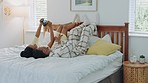 Black couple, bedroom and selfie holding digital camera in pajamas for morning picture for marriage honeymoon in hotel bedroom. Man and woman on bed to relax, love and capture holiday memory