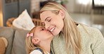 Love, mom and daughter kiss in home with cute smile for care, appreciation and gratitude. Mama, happy and family with sweet and adorable affection from young child in Canada living room.