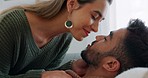 Interracial, couple, love and kiss being happy, bonding and embrace for communication, talking together and at home. Romantic, man and woman with smile, intimate and being loving for romance or hug