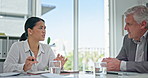 Asian business woman, meeting and discussion for idea, strategy or corporate planning in boardroom. Japanese female employee explaining company ideas, finance or growth to senior executive at office