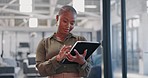 Communication, typing and black woman with a tablet for social media management at a startup. Website, contact and African employee reading information on technology for connection and email