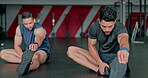 Fitness, friends and stretching legs in gym for health, flexibility or exercise wellness. Training teamwork, sports or men warm up, prepare and get ready before running, exercising or healthy workout