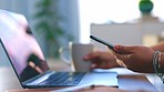 Hands, phone and laptop for remote work and drinking coffee while working on home office table. Freelance woman with smartphone in hand for cloud computing, information technology and internet scroll