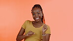 Success, dancing and face of black woman isolated on orange background celebration, winning and clapping. Excited winner, african person or model in studio dance, celebrate and energy for competition