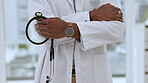 Cardiology doctor, stethoscope and hands closeup of black man in healthcare, heart health and watch for checkup time. Proud medical professional or cardiologist in clinic with audio device or service