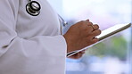 Woman, doctor and hands with tablet in healthcare research, browsing or scrolling for information at hospital. Hand of female medical professional working on touchscreen for medicare search at clinic