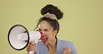 Megaphone, motivation and announcement with a black woman in studio on a green background for a protest or demonstration. Speech, freedom and human rights with a female activist at a government rally