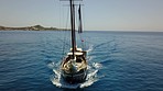 Ocean, sailing and a boat on the water for travel, luxury holiday and summer cruise. Break, tropical and yacht on the sea, traveling and on a trip for vacation, marine activity and recreation