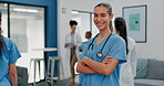 Proud face of woman doctor in busy hospital for healthcare services, leadership and happy career mindset. Confident portrait of young medical professional or female nurse in clinic or health care job