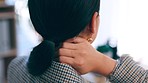 Neck pain, rear view and busines woman in office with burnout, anxiety or posture problem. Spinal, issue and corporate lady with headache, anxiety or stress from deadline, workload or work pressure