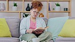 Living room, student book reading and black woman with morning coffee at home feeling calm. Relax, female and lounge of a young person on a couch with college textbook and peace with books in house