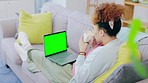 Black woman, sofa and relax with laptop, green screen and mockup space in home living room. Gen z girl, drink latte or coffee cup with computer for video, studying or movie on lounge couch in house