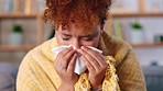 Sick, tissue and woman in living room, sneeze and stress with virus, health and illness. Female, lady and toilet paper with disease, allergy and virus in lounge, blanket or girl blowing nose and sofa