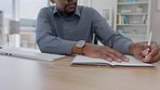 Hands, black man and writing in notebook with computer, business schedule and office administration. Closeup worker, online planning and book of ideas, agenda and desktop strategy management at table