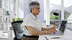 Business, woman and laptop typing at desk for planning, research and internet. Female manager, computer keyboard and technology for website management, email networking or online administration notes