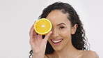 Woman, beauty and orange fruit portrait for skincare in studio with vitamin c dermatology cosmetic. Aesthetic model person on white background with healthy food for self care, facial and natural glow