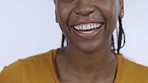 Laughing, smile and mouth of a black woman for dental care isolated on a grey studio background. Healthcare, joke and African girl showing teeth for oral hygiene, dentist results and happiness