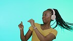 Headphones, music and black woman dancing in studio with smile, color and lights in background. Party, streaming service and dance, African dj on fun online radio station or happiness celebration.