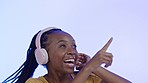 Headphones, excited black woman dancing in studio with color and lights in background with smile and happiness. Music, streaming and dance, African dj on fun online radio station or party celebration