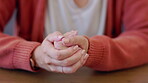 Woman hands, nervous and anxiety or stress about mental health problem or depression at a table. Stressed person crack knuckles or fingers while thinking about abuse, decision and problem or mistake