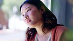 Window, thinking and Asian woman with stress, depression and worried with issues, problems and future. Glass, Japanese female and girl with mental health, depressed and sad with thoughts or wondering