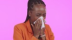 Black woman, sneeze and tissue in studio for flu, healthcare and sick with corporate fashion by purple background. African executive, wellness and safety with blowing nose, toilet paper and allergy