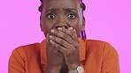 Black woman, shock and face in panic expression looking worried or scared against a pink studio background. Portrait of African American female shocked, anxiety or feeling overwhelmed for bad news