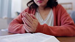 Hands, praying and woman with Bible, Christian and worship with faith, gratitude and trust in God at home. Spiritual, prayer and scripture with religion, female in living room, healing and guidance