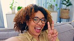 Portrait, selfie and black woman with hand, peace and sign on a sofa, happy and smile in her home. Face, girl and social media influencer with emoji hand on a couch for photo, profile picture or blog