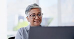 Happy woman on business laptop with email feedback, asset management or data review of profit, sales and finance. Senior manager, boss or female on computer typing report for online market research