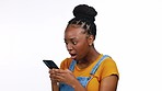 Smile, typing and happy black woman with phone on white background for funny meme, humor and comic text. Communication, social media and girl laugh on smartphone for news, surprise and shocked face