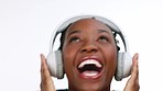 Happy, black woman and headphones for streaming music, excited and celebration against a studio background. African American female, lady and headset with happiness, audio and girl singing with song