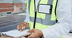 Black man, engineer and hands writing on clipboard for checklist, solar panels or quality check on rooftop. Hand of African male contractor checking installation list and signing off document in city