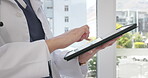 Hands, tablet and medical with a doctor woman at work in a hospital on research or innovation. Data, insurance and healthcare with a female medicine professional working on the internet for advice