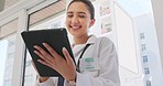 Digital tablet, research and woman doctor in the hospital browsing on the internet for memes while on break. Happy, laughing and female healthcare worker networking on mobile device in medical clinic