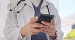 Hands, smartphone and doctor typing message, email or online schedule check at hospital. Technology, communication and connect on medical social media post or internet search for healthcare advice.