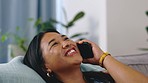 Happy, laughing and woman answering a phone call for communication, conversation and contact. Smile, talking and girl speaking on a mobile for connection, gossip and happiness on a home sofa