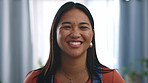 Face, smile and laughing with an asian woman in her home, smiling while feeling positive or carefree. Portrait, happy with laughter with an attractive young female expressing happiness in her house