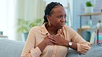 Black woman, sick and chest pain in home, health and stress on sofa with frustrated face. Emergency, girl and breathing problem with burnout, hands and lungs with fatigue on lounge couch with risk