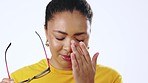 Stress, crying and woman with glasses in a studio with bad news, mental health problem or grief. Sad, depression and face of a female model with an emotional facial expression by a white background.