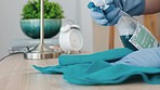 Cleaning, woman hands and spray on surface, shine and furniture of dust, dirt or household safety maintenance. Closeup cleaner wipe table with cloth, detergent and chemical liquid of bacteria in home