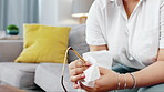 Black woman cleaning glasses, lens and eye care protection with tissue in home. Female hands, cloth and wipe spectacle frames eyewear for clear vision, optic maintenance and dust cleaner for lenses